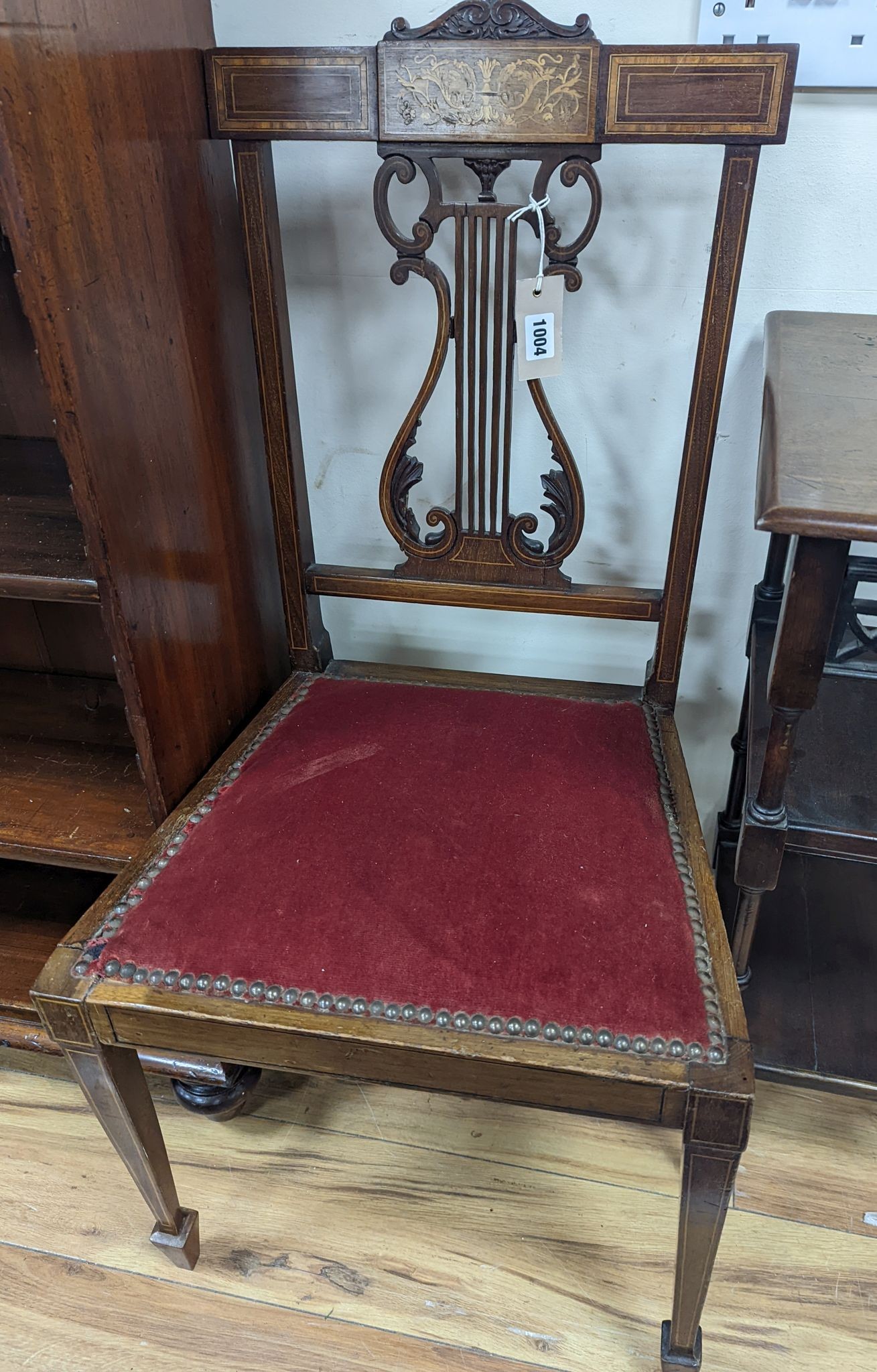 A pair of Edwardian inlaid mahogany lyre back chairs